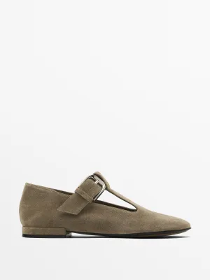 Flat shoes with buckled strap
